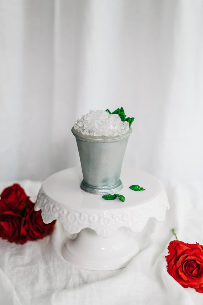hyperrealistic mint julep cake with red sugar roses
